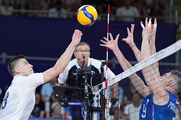 (240730) -- PARIS, July 30, 2024 -- Klemen Cebulj (1st L) of Slovenia spikes the ball during the men s preliminary round pool A match of volleyball between Slovenia and Serbia at the Paris 2024 Olympic Games, Olympische Spiele, Olympia, OS in Paris, France, July 30, 2024. ) (PARIS2024)FRANCE-PARIS-OLY-VOLLEYBALL JuxHuanzong 