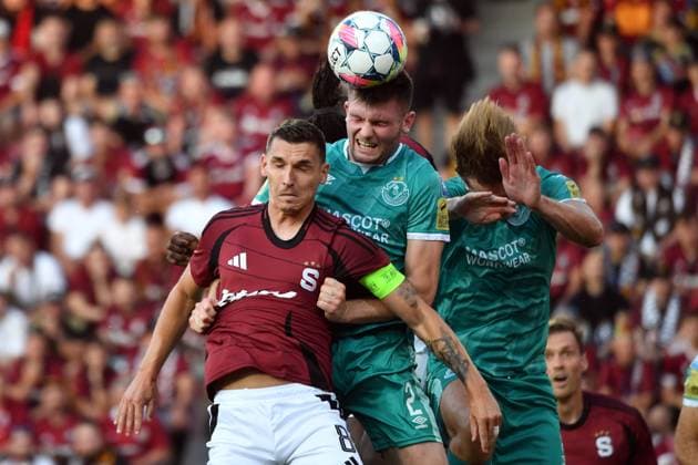 July 30, 2024, Prague, Czech Republic: Captain DAVID PAVELKA of Sparta Praha (red) fight for ball with Shamrock Rover s JOSHUA HONOHAN (2) during second qualifying round UEFA Champions League, 2nd leg match at July 30, 2024, in Prague in the Czech Republic. Prague Czech Republic - ZUMAr156 20240730_aap_r156_010 Copyright: xSlavekxRutax