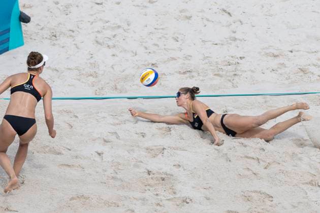 Cinja TILLMANN GER, 2 digs, hits the ball, Svenja MUELLER MÜLLER GER, 1 looks on, action beach volleyball women Mueller S and Tillmann C GER vs Hermannova B and Stochlova M S CZE , final score 2 0, preliminary round group C, on 31 07 2024, Olympic Games Paris 2024 France Â
