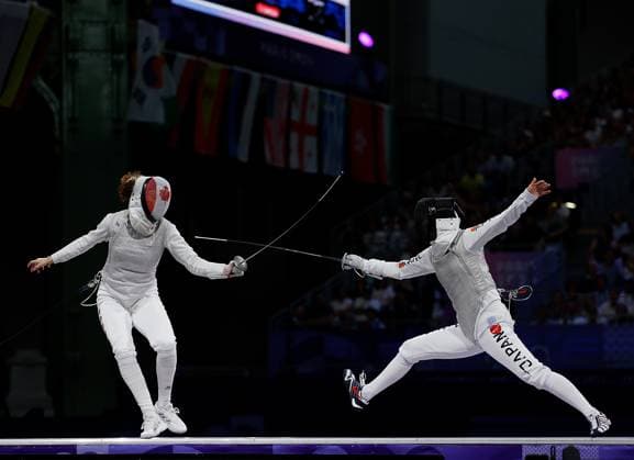(240801) -- PARIS, Aug. 1, 2024 -- Eleanor Harvey (L) of Canada competes against Miyawaki Karin of Japan during the women s foil team bronze medal match of fencing between Canada and Japan at the Paris 2024 Olympic Games, Olympische Spiele, Olympia, OS in Paris, France, Aug. 1, 2024. ) (PARIS2024) FRANCE-PARIS-OLY-FENCING FeixMaohua 