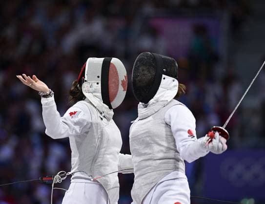 (240801) -- PARIS, Aug. 1, 2024 -- Guo Jessica Zi Jia (L) of Canada and Kikuchi Komaki of Japan react during the women s foil team bronze medal match of fencing between Canada and Japan at the Paris 2024 Olympic Games, Olympische Spiele, Olympia, OS in Paris, France, Aug. 1, 2024. ) (PARIS2024) FRANCE-PARIS-OLY-FENCING ZhangxHongxiang 