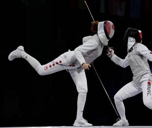 (240801) -- PARIS, Aug. 1, 2024 -- Eleanor Harvey (L) of Canada competes against Azuma Sera of Japan during the women s foil team bronze medal match of fencing between Canada and Japan at the Paris 2024 Olympic Games, Olympische Spiele, Olympia, OS in Paris, France, Aug. 1, 2024. ) (PARIS2024) FRANCE-PARIS-OLY-FENCING FeixMaohua 