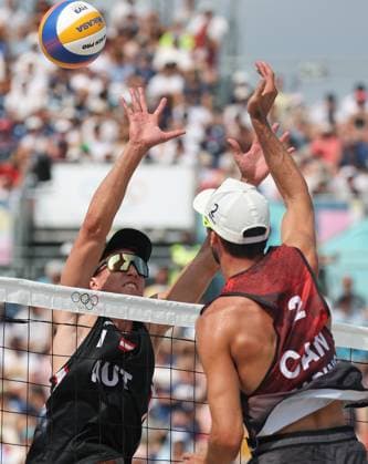 (240802) -- PARIS, Aug. 2, 2024 -- Daniel Dearing (R) of Canada competes against Julian Hoerl of Austria during the men s preliminary phase pool E of Beach volleyball, Beachvolleyball between Julian Hoerl Alexander Horst of Austria and Samuel Schachter Daniel Dearing of Canada at the Paris 2024 Olympic Games, Olympische Spiele, Olympia, OS in Paris, France, Aug. 2, 2024. ) (PARIS2024) FRANCE-PARIS-OLY-BEACH VOLLEYBALL HuangxZongzhi 