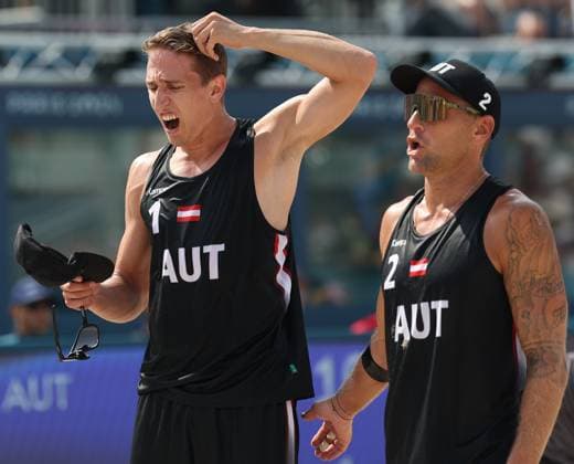 (240802) -- PARIS, Aug. 2, 2024 -- Julian Hoerl Alexander Horst (R) of Austria reacts during the men s preliminary phase pool E of Beach volleyball, Beachvolleyball between Julian Hoerl Alexander Horst of Austria and Samuel Schachter Daniel Dearing of Canada at the Paris 2024 Olympic Games, Olympische Spiele, Olympia, OS in Paris, France, Aug. 2, 2024. ) (PARIS2024) FRANCE-PARIS-OLY-BEACH VOLLEYBALL HuangxZongzhi 
