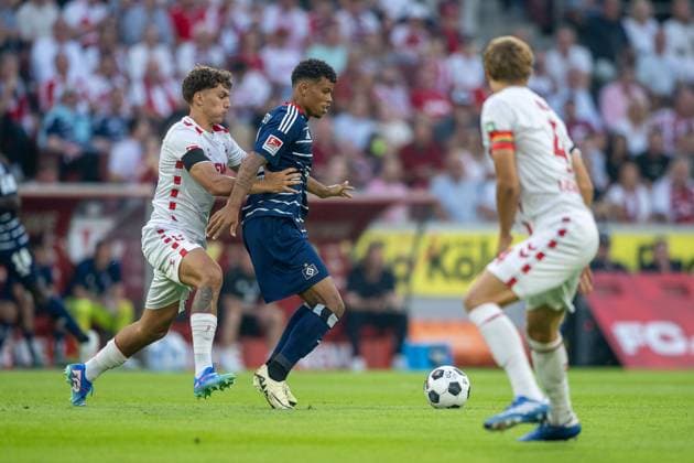 02 08 2024, Soccer 2 Bundesliga, Season 2024 2025, Opening match, 1 FC Koeln Hamburger SV at RheinEnergie Stadion in Koeln duel between Julian Pauli 1 FC Koeln, 24 and Ransford Koenigsdoerffer Hamburger SV, 11 Important note In accordance with the regulations of the DFL German Football League and the DFB German Football Association, it is prohibited to utilize or have utilized photographs taken in the stadium and or of the match in the form of sequential images and or video-like photo series Foto Kirchner Media TH Copyright: xKirchner-Media THx