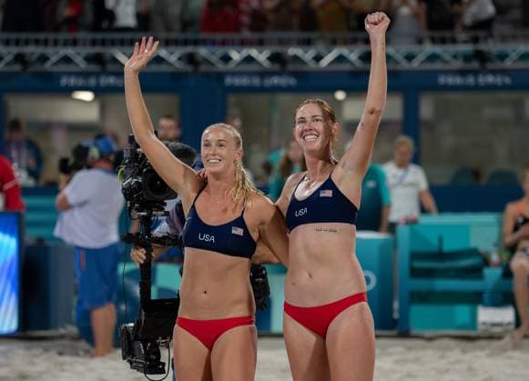 The USA team of Sara Hughes and Kelly Cheng (R) celebrate their 2-0 victory over the German team of Svenja Muller and Cinja Tillman at the Beach volleyball, Beachvolleyball Arena at the Summer Olympic Games, Olympische Spiele, Olympia, OS in Paris, France, on Friday, August 2, 2024.  OLY20240802015 KatexBenic