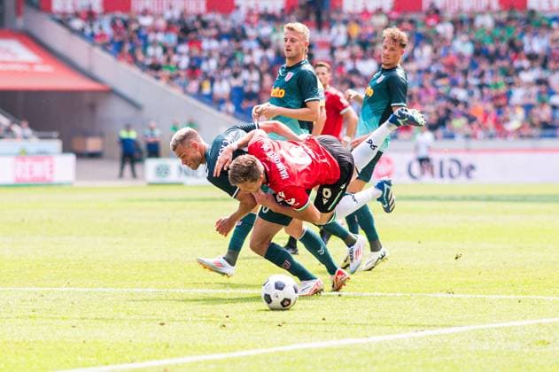 03 08 2024 Soccer, 2024 2025, 2 Bundesliga, 1 Matchday, Hannover 96 SSV Jahn Regensburg L R Benedikt Saller Regensburg , Fabian Kunze Hannover DFL REGULATIONS PROHIBIT ANY USE OF PHOTOGRAPHS AS IMAGE SEQUENCES AND OR QUASI VIDEO