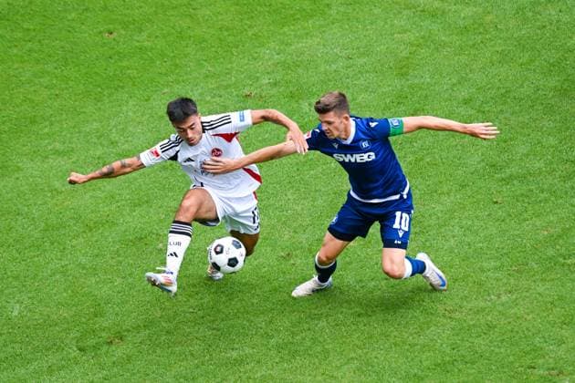 Jens Castrop 1 FC Nuernberg and Marvin Wanitzek Karlsruher SC in a duel, 2 Bundesliga, Karlsruher SC vs 1 FC Nuernberg, BBBank Wildpark on August 03, 2024 in Karlsruhe, Germany Photo by Silas Schueller DeFodi Images Jens Castrop 1 FC Nuernberg and Marvin Wanitzek Karlsruher SC battle for the ball, 2 Bundesliga, Karlsruher SC vs 1 FC Nuernberg, BBBank Wildpark on August 3, 2024 in Karlsruhe, Germany Photo by Silas Schueller DeFodi Images Defodi 738 738 KSCFCN 20240803 160 Defodi-738