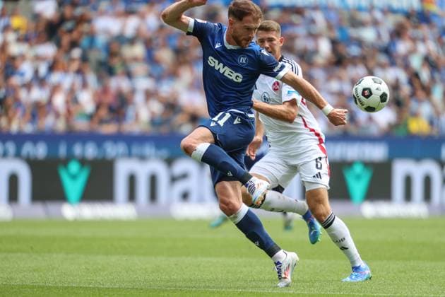 claims the ball Budu Zivzivadze Karlsruher SC, 11 vs Florian Flick 1 FC Nuernberg, 06 Karlsruher SC vs 1 FC Nuernberg, Football, 2 Liga, 1 Matchday, 2024 2025, 03 08 2024 , DFL REGULATIONS PROHIBIT ANY USE OF PHOTOGRAPHS AS IMAGE SEQUENCES AND OR QUASI VIDEO Karlsruher SC vs 1 FC Nuernberg, Football, 2 Liga, 1 Matchday, 2024 2025, 03 08 2024 Karlsruhe Copyright: xEibner-Pressefoto JanxPrihodax EP_JPA