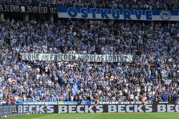 GER, Berlin, Football, Hertha BSC vs SC Paderborn, 2 Bundesliga, Olympiastadion, 03 08 2024, The fans hold a banner in memory of Andreas Lorenz with the inscription Ruhe in Frieden, Banner, Plakat, dfl dfb regulations prohibit any use of photographs as image sequences and or quasi video Copyright: HMBxMedia UwexKoch