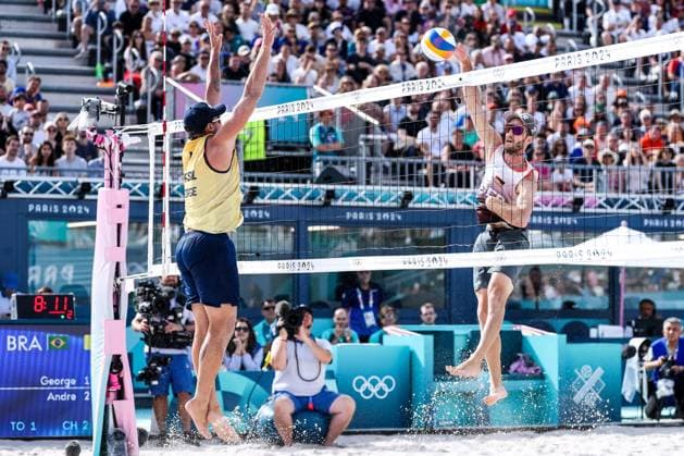 FRA, Paris, Olympic Games Paris 2024, 03 08 2024, Beach Volleyball Mens Round of 16, Eiffel Tower Centre Court Nils Ehlers Germany, 1 and Clemens Wickler Germany, 2 against George Souto Maior Wanderley Brazil, 1 and Andre Loyola Stein Brazil, 2 George Souto Maior Wanderley Brazil, 1 , Clemens Wickler Germany, 2 in stroke Copyright: HMBxMedia SteffiexWunderl