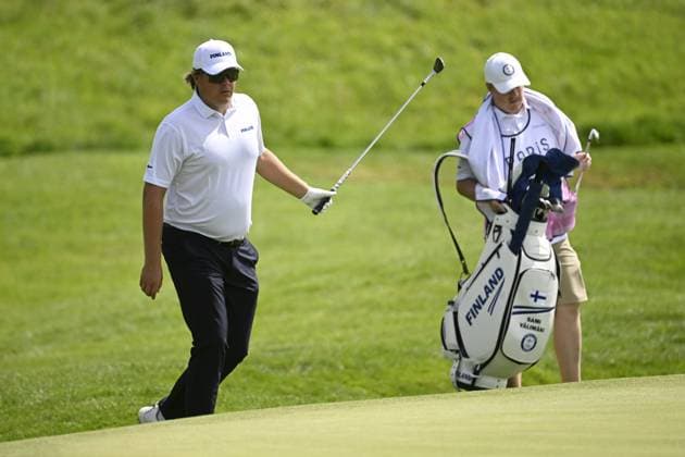 Sami Välimäki of Finland competes with caddie Joonas Lehto (R) during men s individual stroke play of golf at the Paris Summer Olympic Games, Olympische Spiele, Olympia, OS in Le Golf National on August 4, 2024. Paris France LKFTJK20240804140659UEXW  Copyright: xAnttixAimo-Koivistox LKFTJK20240804140659UEXW