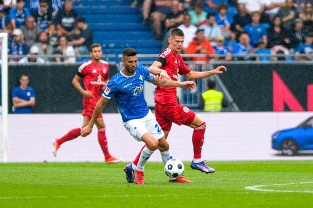 Klaus Gjasula SV Darmstadt 98, 23 in duel with Danny Schmidt Fortuna Duesseldorf , 22 , GER, SV Darmstadt 98 vs Fortuna Duesseldorf, Soccer, 2 Bundesliga, 1 Matchday, Season 2024 2025, 04 08 2024 DFL REGULATIONS PROHIBIT ANY USE OF PHOTOGRAPHS as IMAGE SEQUENCES and or QUASI VIDEO GER, SV Darmstadt 98 vs Fortuna Duesseldorf, Soccer, 2 Bundesliga, 1 Matchday, Season 2024 2025, 04 08 2024 Darmstadt Copyright: xEibner-Pressefoto FlorianxWieganx EP_FWD