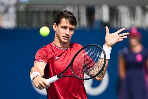 MONTREAL, QC - AUGUST 04: Camilo Ugo Carabelli (ARG) returns the ball during a qualifying round match at ATP, Tennis Herren National Bank Open on August 04, 2024 at IGA Stadium in Montreal, QC (Photo by David Kirouac Icon Sportswire) TENNIS: AUG 04 National Bank Open EDITORIAL USE ONLY Icon240804004