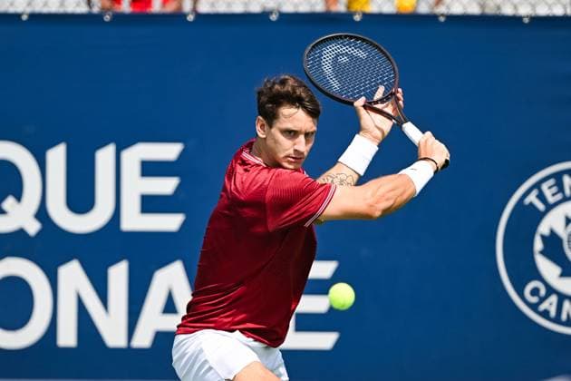 MONTREAL, QC - AUGUST 04: Camilo Ugo Carabelli (ARG) returns the ball during a qualifying round match at ATP, Tennis Herren National Bank Open on August 04, 2024 at IGA Stadium in Montreal, QC (Photo by David Kirouac Icon Sportswire) TENNIS: AUG 04 National Bank Open EDITORIAL USE ONLY Icon240804005