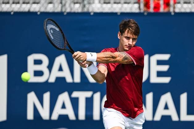 MONTREAL, QC - AUGUST 04: Camilo Ugo Carabelli (ARG) returns the ball during a qualifying round match at ATP, Tennis Herren National Bank Open on August 04, 2024 at IGA Stadium in Montreal, QC (Photo by David Kirouac Icon Sportswire) TENNIS: AUG 04 National Bank Open EDITORIAL USE ONLY Icon240804006