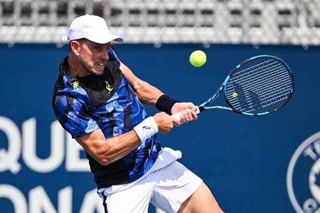 MONTREAL, QC - AUGUST 04: James Duckworth (AUS) returns the ball during a qualifying round match at ATP, Tennis Herren National Bank Open on August 04, 2024 at IGA Stadium in Montreal, QC (Photo by David Kirouac Icon Sportswire) TENNIS: AUG 04 National Bank Open EDITORIAL USE ONLY Icon240804010
