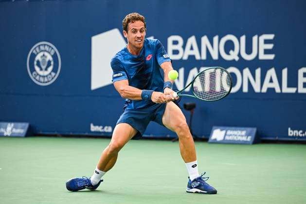MONTREAL, QC - AUGUST 04: Roberto Carballes Baena (ESP) returns the ball during a qualifying round match at ATP, Tennis Herren National Bank Open on August 04, 2024 at IGA Stadium in Montreal, QC (Photo by David Kirouac Icon Sportswire) TENNIS: AUG 04 National Bank Open EDITORIAL USE ONLY Icon240804028