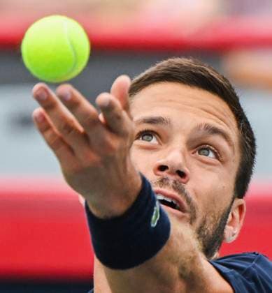 August 5, 2024, Montreal, Pq, Canada: Alexis Galarneau of Canada tosses the ball as he serves to Rinky Hijikata of Australia during qualifying tennis action at the National Bank Open in Montreal, Monday, August 5, 2024. Canada News - August 5, 2024  - ZUMAc35_ 20240805_zaf_c35_013 Copyright: xGrahamxHughesx