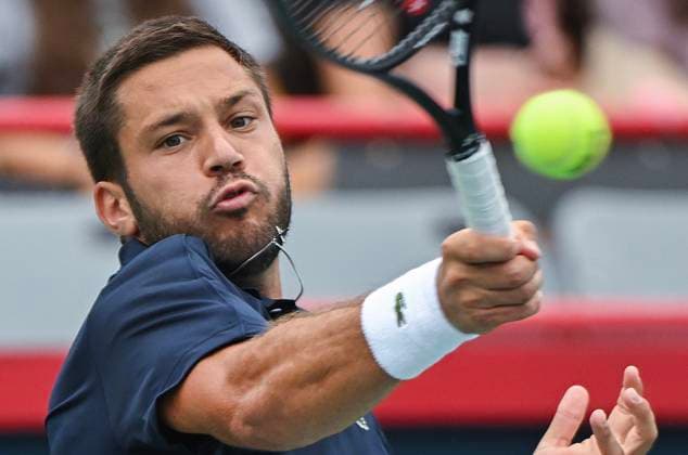 August 5, 2024, Montreal, Pq, Canada: Alexis Galarneau of Canada plays a shot to Rinky Hijikata of Australia during their qualifying match at the National Bank Open tennis tournament in Montreal, Monday, August 5, 2024. Canada News - August 5, 2024  - ZUMAc35_ 20240805_zaf_c35_021 Copyright: xGrahamxHughesx
