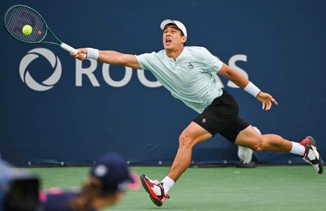 August 5, 2024, Montreal, Pq, Canada: Mackenzie McDonald, of the United States, lunges for the ball during his qualifying match against James Duckworth, of Australia, at the National Bank Open tennis tournament in Montreal on Monday, August 5, 2024. Mackenzie McDonald, James Duckworth, - ZUMAc35_ 20240805_zaf_c35_032 Copyright: xGrahamxHughesx
