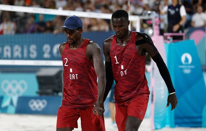 (240805) -- PARIS, Aug. 5, 2024 -- Cherif Younousse (R) Ahmed Tijan of Qatar celebrate scoring during the Beach volleyball, Beachvolleyball men s round of 16 match against Marco Grimalt Esteban Grimalt of Chile at the Paris 2024 Olympic Games, Olympische Spiele, Olympia, OS in Paris, France, Aug. 5, 2024. ) (PARIS2024) FRANCE-PARIS-OLY-BEACH VOLLEYBALL FeixMaohua 