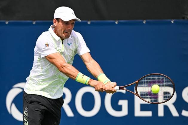 MONTREAL, QC - AUGUST 06: Roberto Bautista Agut (ESP) returns the ball during a second round qualification match at ATP, Tennis Herren National Bank Open on August 06, 2024 at IGA Stadium in Montreal, QC (Photo by David Kirouac Icon Sportswire) TENNIS: AUG 06 National Bank Open EDITORIAL USE ONLY Icon240806010
