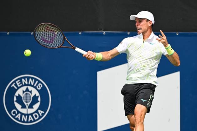 MONTREAL, QC - AUGUST 06: Roberto Bautista Agut (ESP) returns the ball during a second round qualification match at ATP, Tennis Herren National Bank Open on August 06, 2024 at IGA Stadium in Montreal, QC (Photo by David Kirouac Icon Sportswire) TENNIS: AUG 06 National Bank Open EDITORIAL USE ONLY Icon240806012