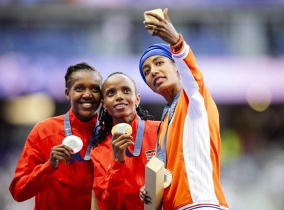 PARIS - Faith Kipyegon of Kenya, Beatrice Chebet of Kenya and the Dutch athlete Sifan Hassan during the ceremony the day after the 5000 meters during the Olympic Games, Olympische Spiele, Olympia, OS ANP ROBIN VAN LONKHUIJSEN xVIxANPxSportx xxANPxIVx 505319965 originalFilename: 505319965.jpg