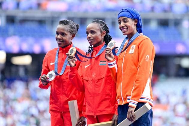 2024-08-06 Athletics - Olympic Games, Olympische Spiele, Olympia, OS Paris 2024 - Day 11 PARIS, FRANCE - AUGUST 6: Beatrice Chebet of Kenya winner of the silver medal, Faith Kipyegon of Kenya winner of the gold medal, Sifan Hassan of the Netherlands celebrating brons medal during the medal ceremony after competing in the Women s 5000m Final - Medal Ceremony during Day 11 of Athletics - Olympic Games Paris 2024 at Stade de France on August 6, 2024 in Paris, France. (Photo by Andy Astfalck BSR Agency) Paris France Content not available for redistribution in The Netherlands directly or indirectly through any third parties. Copyright: xBSRxAgencyx