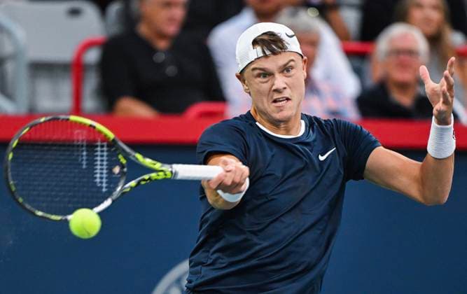 August 6, 2024, Montreal, Pq, Canada: Holger Rune of Denmark plays a shot to Roberto Bautista Agut of Spain during their first round match at the National Bank Open tennis tournament in Montreal, Tuesday, August 6, 2024. Roberto Bautista Agut, Holger Rune,  - ZUMAc35_ 20240806_zaf_c35_183 Copyright: xGrahamxHughesx