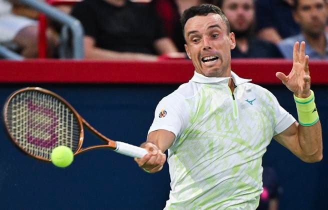 August 6, 2024, Montreal, Pq, Canada: Roberto Bautista Agut of Spain plays a shot to Holger Rune of Denmark during their first round match at the National Bank Open tennis tournament in Montreal, Tuesday, August 6, 2024. Roberto Bautista Agut, Holger Rune,  - ZUMAc35_ 20240806_zaf_c35_187 Copyright: xGrahamxHughesx