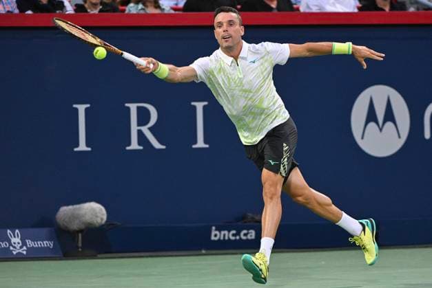 August 6, 2024, Montreal, Pq, Canada: Roberto Bautista Agut of Spain lunges for the ball during his first round match against Holger Rune of Denmark at the National Bank Open tennis tournament in Montreal, Tuesday, August 6, 2024. Roberto Bautista Agut, Holger Rune,  - ZUMAc35_ 20240806_zaf_c35_189 Copyright: xGrahamxHughesx