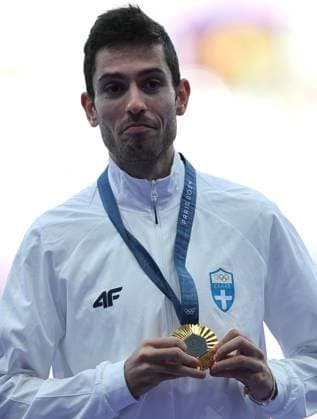 (240807) -- PARIS, Aug. 7, 2024 -- Gold medalist Miltiadis Tentoglou of Greece reacts during the victory ceremony of the men s long jump of Athletics at the Paris 2024 Olympic Games, Olympische Spiele, Olympia, OS in Paris, France, Aug. 7, 2024. ) (PARIS2024) FRANCE-PARIS-OLY-ATHLETICS-LONG JUMP-MEN LixGang 