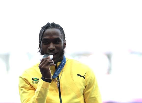(240807) -- PARIS, Aug. 7, 2024 -- Silver medalist Wayne Pinnock of Jamaica reacts during the victory ceremony of the men s long jump of Athletics at the Paris 2024 Olympic Games, Olympische Spiele, Olympia, OS in Paris, France, Aug. 7, 2024. ) (PARIS2024) FRANCE-PARIS-OLY-ATHLETICS-LONG JUMP-MEN LixGang 