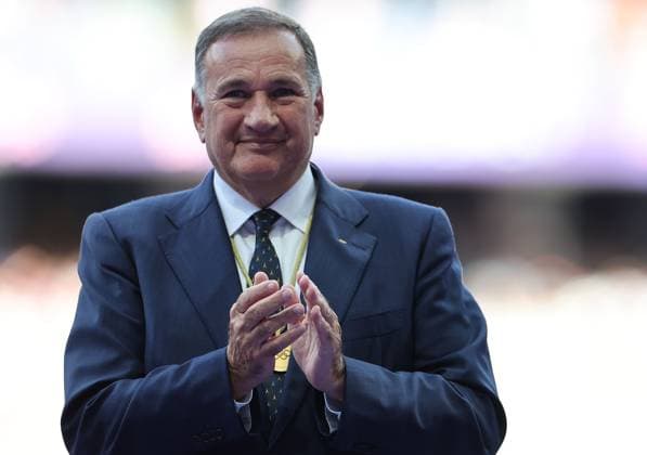 (240807) -- PARIS, Aug. 7, 2024 -- Hellenic Olympic Committee President and International Olympic Committee (IOC) member Spyros Capralos reacts during the victory ceremony of the men s long jump of Athletics at the Paris 2024 Olympic Games, Olympische Spiele, Olympia, OS in Paris, France, Aug. 7, 2024. ) (PARIS2024) FRANCE-PARIS-OLY-ATHLETICS-LONG JUMP-MEN LixGang 