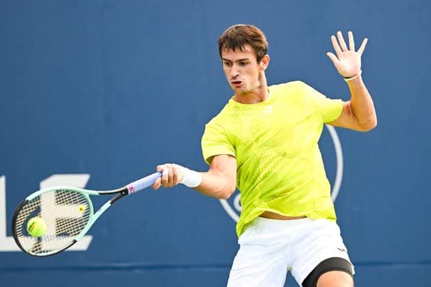 MONTREAL, QC - AUGUST 07: Mariano Navone (ARG) returns the ball during a first round match at ATP, Tennis Herren National Bank Open on August 07, 2024 at IGA Stadium in Montreal, QC (Photo by David Kirouac Icon Sportswire) TENNIS: AUG 07 National Bank Open EDITORIAL USE ONLY Icon240807064