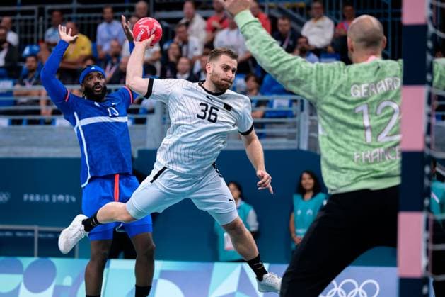 Paris, France Handball Men Quarterfinals Germany France from left Dika Mem France , Lukas Mertens Germany , Goalkeeper Vincent Gerard France Lille Stade Pierre Mauroy France