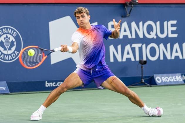 August 7, 2024, Montreal, Quebec, Canada: FLAVIO COBOLLI from Italia returning ball in first set against Felix Auger-Aliassime from Canada from Canada in first round of Canadian Open at IGA Stadium in Montreal, Quebec, Canada Montreal Canada - ZUMAl189 20240807_zsp_l189_063 Copyright: xYannickxLegarex