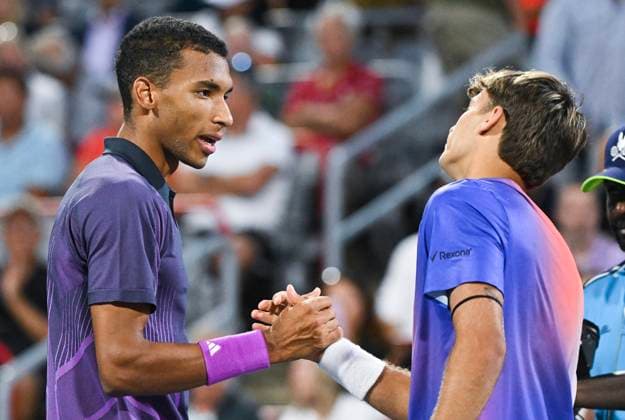 August 7, 2024, Montreal, Pq, Canada: Felix Auger-Aliassime of Canada, left, and Flavio Cobolli of Italy shake hands following their first round match at the National Bank Open tennis tournament in Montreal, Wednesday, August 7, 2024. Flavio Cobolli, Félix Auger-Aliassime, - ZUMAc35_ 20240807_zaf_c35_243 Copyright: xGrahamxHughesx