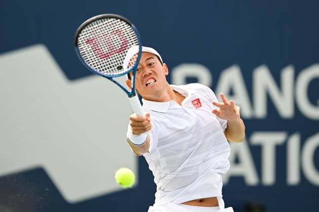 MONTREAL, QC - AUGUST 08: Kei Nishikori (JPN) returns the ball during a second round match at ATP, Tennis Herren National Bank Open on August 08, 2024 at IGA Stadium in Montreal, QC (Photo by David Kirouac Icon Sportswire) TENNIS: AUG 08 National Bank Open EDITORIAL USE ONLY Icon240808003
