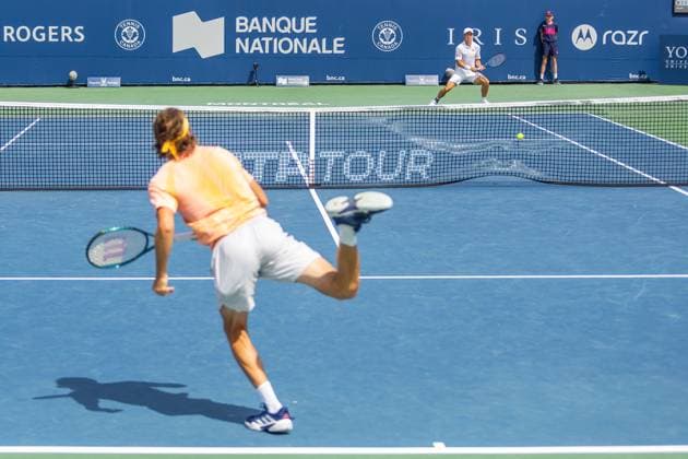 August 8, 2024, Montreal, Quebec, Canada: View from behind of STEFANOS TSITSIPAS from Greece service hitting net in first set against Kei Nishikori from Japan in second round of Canadian Open at IGA Stadium in Montreal, Quebec, Canada Montreal Canada - ZUMAl189 20240808_zsp_l189_001 Copyright: xYannickxLegarex