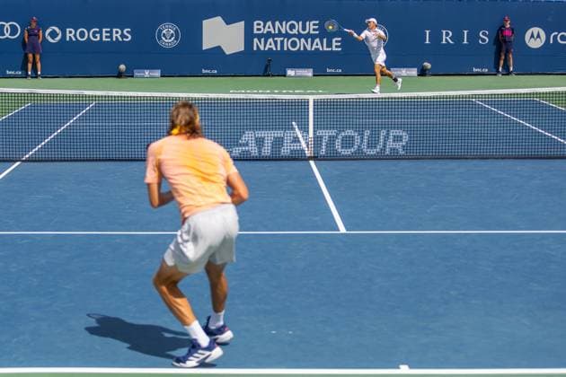 August 8, 2024, Montreal, Quebec, Canada: KEI NISHIKORI from Japan returning ball in first set against Stefanos Tsitsipas from Greece from Greece in second round of Canadian Open at IGA Stadium in Montreal, Quebec, Canada. View from the opposite site with Stefanos Tsitsipas from Greece in foreground Montreal Canada - ZUMAl189 20240808_zsp_l189_002 Copyright: xYannickxLegarex
