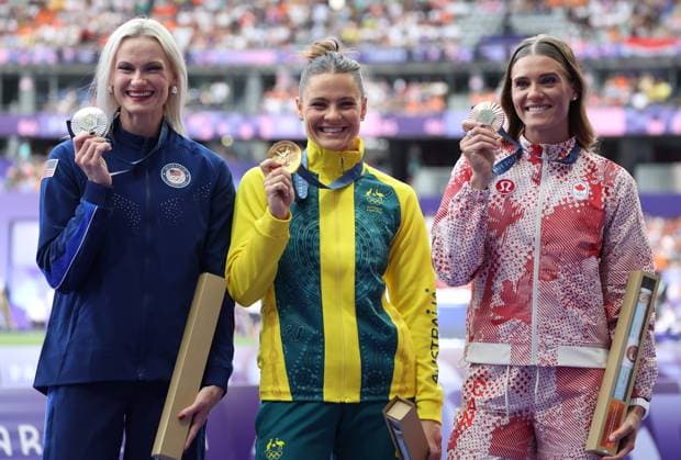 Women s Pole Vault gold medalist Nina Kennedy of Australia (C), silver medalist Katie Moon of the U.S. (L) and bronze medalist Alysha Newman of Canada stand on the podium for the medals ceremony during the Paris 2024 Olympic Games, Olympische Spiele, Olympia, OS Athletics competition at the Stade de France in Paris, France, on Thursday, August 8, 2024.  OLY202408081708 HUGOxPHILPOTT