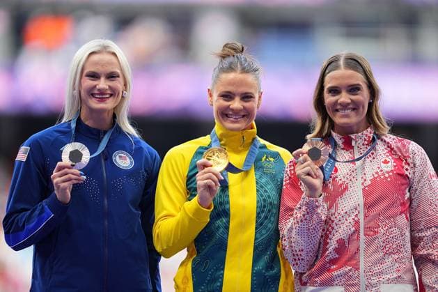 (240808) -- PARIS, Aug. 8, 2024 -- Gold medalist Nina Kennedy (C) of Australia, silver medalist Katie Moon (L) of the United States and bronze medalist Alysha Newman of Canada react during the victory ceremony of the women s pole vault of Athletics at the Paris 2024 Olympic Games, Olympische Spiele, Olympia, OS in Paris, France, Aug. 8, 2024. ) (PARIS2024) FRANCE-PARIS-OLY-ATHLETICS-POLE VAULT-WOMEN XuxChang 