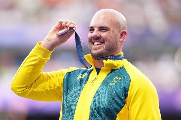 (240808) -- PARIS, Aug. 8, 2024 -- Bronze medalist Matthew Denny of Australia reacts during the victory ceremony of the men s discus throw of Athletics at the Paris 2024 Olympic Games, Olympische Spiele, Olympia, OS in Paris, France, Aug. 8, 2024. ) (PARIS2024) FRANCE-PARIS-OLY-ATHLETICS-DISCUS THROW-MEN XuxChang 
