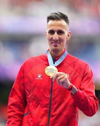 (240808) -- PARIS, Aug. 8, 2024 -- Gold medalist Soufiane El Bakkali of Morocco reacts during the victory ceremony of the men s 3000m steeplechase of Athletics at the Paris 2024 Olympic Games, Olympische Spiele, Olympia, OS in Paris, France, Aug. 8, 2024. ) (PARIS2024) FRANCE-PARIS-OLY-ATHLETICS-3000M STEEPLECHASE-MEN XuxChang 