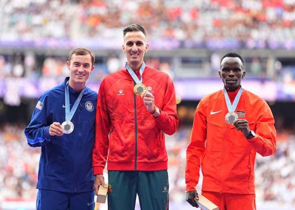 (240808) -- PARIS, Aug. 8, 2024 -- Gold medalist Soufiane El Bakkali (C) of Morocco, silver medalist Kenneth Rooks (L) of the United States and bronze medalist Abraham Kibiwot of Kenya react during the victory ceremony of the men s 3000m steeplechase of Athletics at the Paris 2024 Olympic Games, Olympische Spiele, Olympia, OS in Paris, France, Aug. 8, 2024. ) (PARIS2024) FRANCE-PARIS-OLY-ATHLETICS-3000M STEEPLECHASE-MEN XuxChang 
