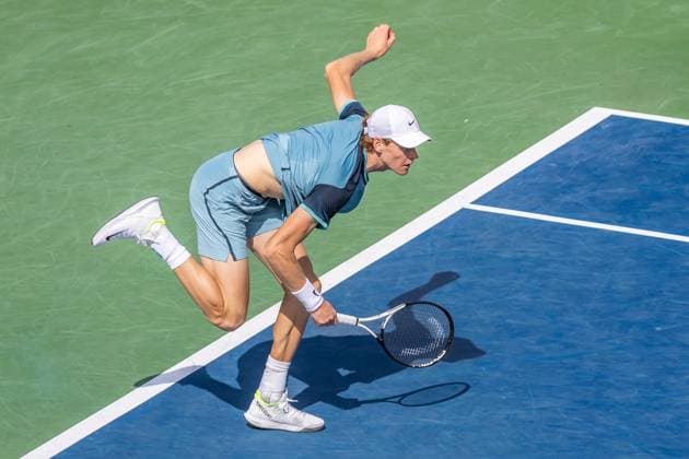 August 8, 2024, Montreal, Quebec, Canada: JANNIK SINNER from Italia out of balance on one feat after hitting the ball in first set against Borna Coric from Croatia in second round of Canadian Open at IGA Stadium in Montreal, Quebec, Canada. View from above with high contrast shadow Montreal Canada - ZUMAl189 20240808_zsp_l189_049 Copyright: xYannickxLegarex