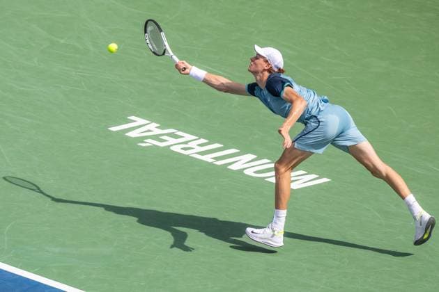 August 8, 2024, Montreal, Quebec, Canada: JANNIK SINNER from Italia stretching trying to reach the ball in first set against Borna Coric from Croatia in second round of Canadian Open at IGA Stadium in Montreal, Quebec, Canada. View from above with Montreal logo and high contrast shadow Montreal Canada - ZUMAl189 20240808_zsp_l189_050 Copyright: xYannickxLegarex